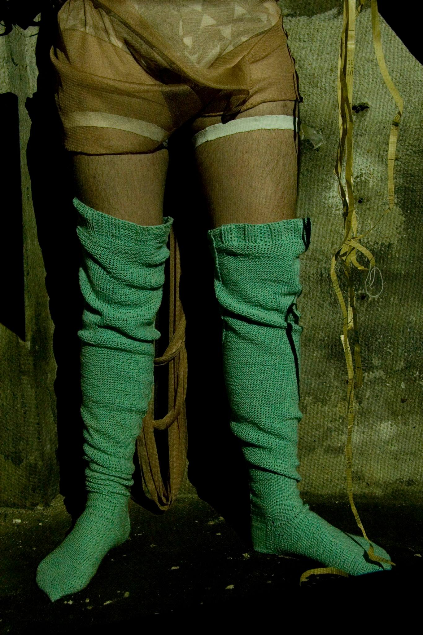 Manuel wearing a pair of handwoven sock suspenders